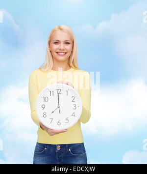 student with wall clock Stock Photo