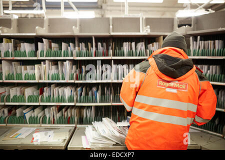 Royal Mail Manchester South delivery office workers sorting the mail by hand Stock Photo