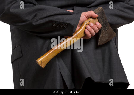 Man in suit hiding an axe behind his back isolated on white background Stock Photo