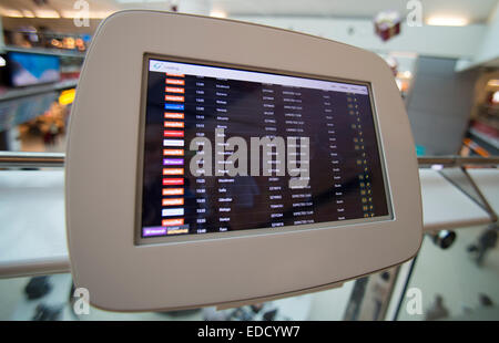 modern touchscreen flight information screen at Gatwick Airport Departures lounge Stock Photo