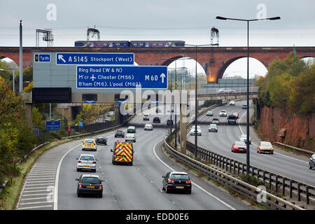 The M60 (was M63) motorway running through Stockport, with The railway viaduct in the distance Stock Photo