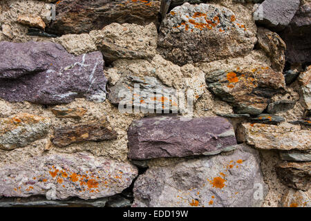 dry wall built with natural stone mixed Stock Photo