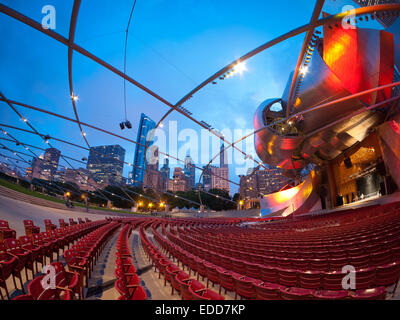 A fisheye, wide angle, night view of the Jay Pritzker Pavilion, Millennium Park and the Chicago skyline. Stock Photo