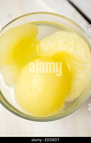 Canned pear dessert in a transparent bowl Stock Photo