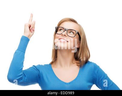 smiling woman pointing her finger up Stock Photo