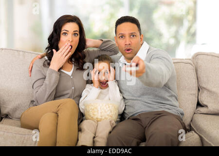 family watching scary movies at home Stock Photo