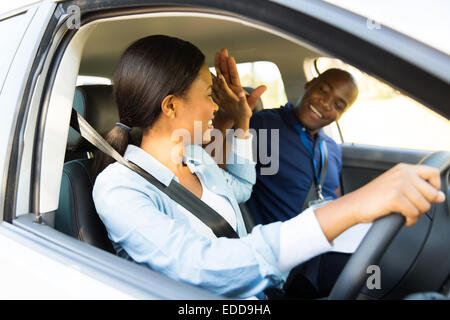 Smiling black guy driver sitting inside brand new car, looking at back  seat, closeup, copy space. Happy african american man enjoying driving  comforta Stock Photo - Alamy