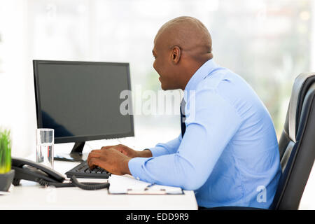 young afro American businessman working on a computer in modern office Stock Photo