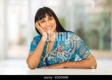 beautiful Indian woman sitting at home