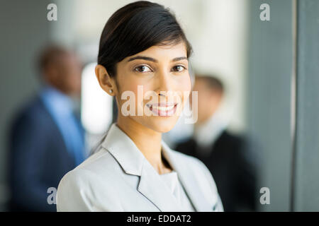 happy female Indian business executive in modern office Stock Photo