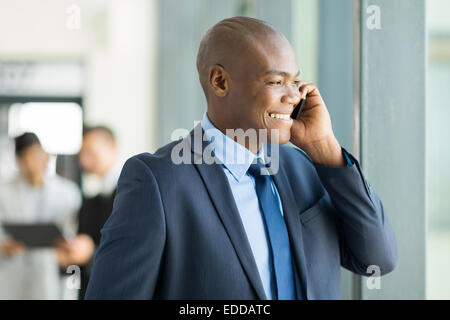 handsome African American business executive talking on cell phone Stock Photo