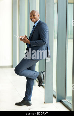 handsome African businessman using tablet pc Stock Photo