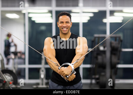 strong middle aged man doing triceps exercise Stock Photo