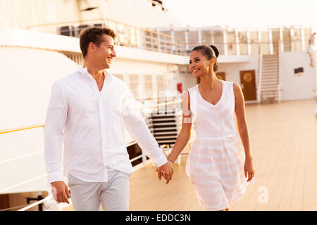 cheerful young couple walking on cruise ship Stock Photo