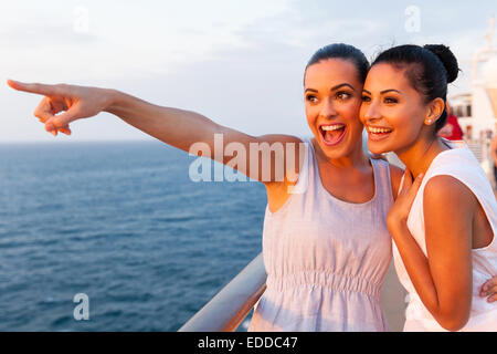 two happy friends on a cruise ship Stock Photo