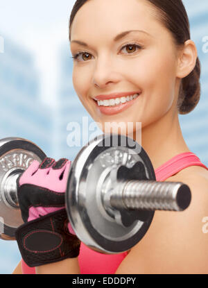 asian sporty woman with heavy dumbbell Stock Photo