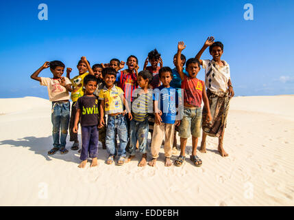 Young Socotrian boys posing in the sand dunes at the south coast of the island of Socotra, Yemen Stock Photo