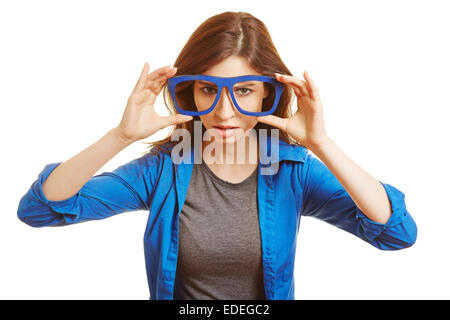 Young woman holding fake nerd glasses in front of her face Stock Photo