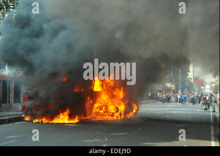 Dhaka, Bangladesh. 6th January, 2015. At least six vehicles were set on fire in Dhaka on the first day of the countrywide non-stop blockade program enforced by the BNP-led 20-party alliance. Credit:  Mamunur Rashid/Alamy Live News Stock Photo