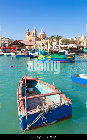 Marsaxlokk Harbour Our Lady of Pompeii Church and traditional fishing boats Marsaxlokk Malta EU Europe Stock Photo