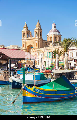 Marsaxlokk Harbour Our Lady of Pompeii Church and traditional fishing boats Marsaxlokk Malta EU Europe Stock Photo