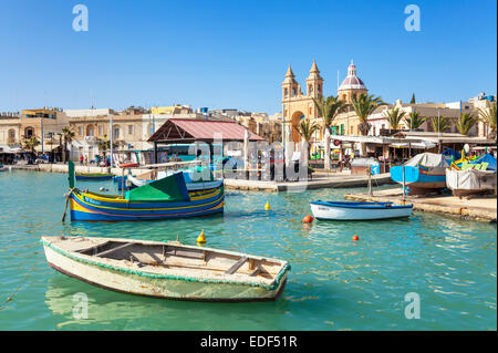 Marsaxlokk Harbour Our Lady of Pompeii Church and traditional fishing boats Marsaxlokk Malta EU Europe Stock Photo