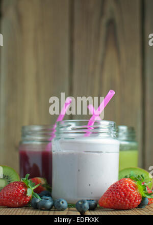 Three different flavoured smoothies in jars with space for text Stock Photo