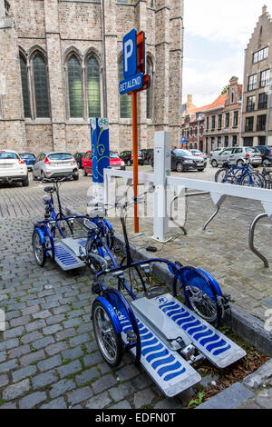 E-bike for transportation of wheelchairs, charging station in the historic center of Ypres, Stock Photo