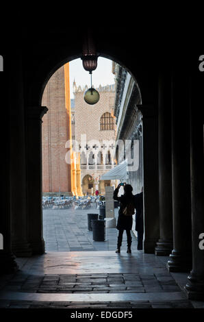 Tourist taking photos at the entrance to piazza San Marco, Venice Stock Photo