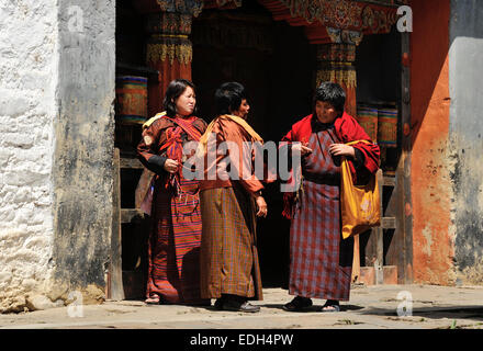 Women wearing traditional clothes in Jampey Lhakhang temple, Jakar, Bumthang, Bhutan Stock Photo