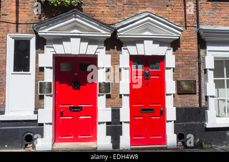 Two Red Painted Doors in Princes Street Norwich Norfolk England Stock Photo