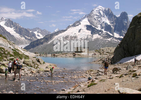 Tourists and walkers at Lac Blanc one of the most popular walks from Chamonix in the French Alps Stock Photo