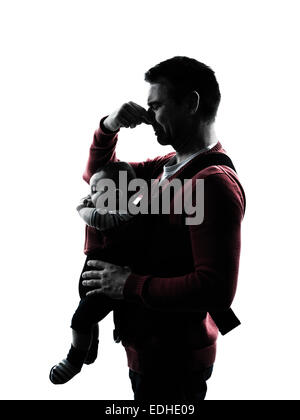 parents with baby in silhouettes on white background Stock Photo