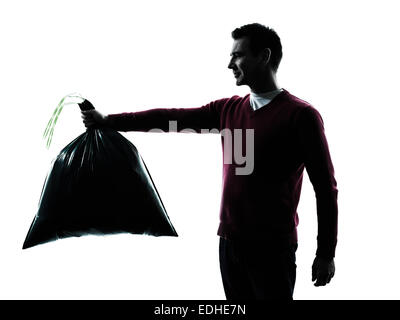 man dumping garbage bag in silhouettes on white background Stock Photo