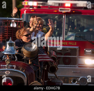 Antique firetruck in a Fourth of July parade in Menomonee Falls WI Stock Photo