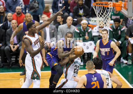 Milwaukee, WI, USA. 6th Jan, 2015. Milwaukee Bucks forward Khris Middleton (22) takes a charge during the NBA game between the Phoenix Suns and the Milwaukee Bucks at the BMO Harris Bradley Center in Milwaukee, WI. Suns defeated the Bucks 102-96. John Fisher/CSM/Alamy Live News Stock Photo