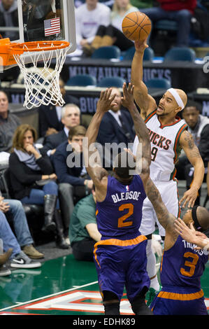 Milwaukee, WI, USA. 6th Jan, 2015. Milwaukee Bucks guard Jerryd Bayless (19) goes in for a shot on Phoenix Suns guard Eric Bledsoe (2) during the NBA game between the Phoenix Suns and the Milwaukee Bucks at the BMO Harris Bradley Center in Milwaukee, WI. Suns defeated the Bucks 102-96. John Fisher/CSM/Alamy Live News Stock Photo