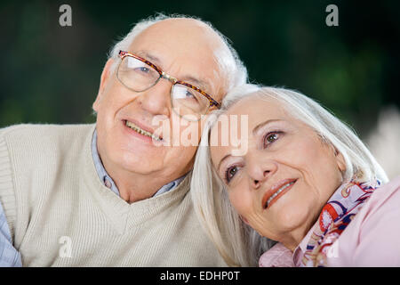 Loving Senior Couple Looking Away Stock Photo