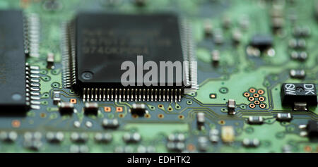 Micro-circuitry from a computer. The integrated circuit board has microchips.. Stock Photo
