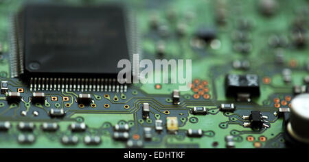 Micro-circuitry from a computer. The integrated circuit board has microchips.. Stock Photo
