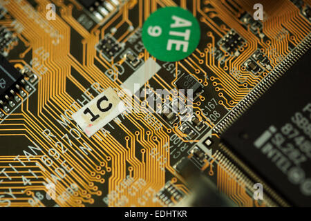 A circuit board with microchips. The integrated circuit comes from a computer. Stock Photo