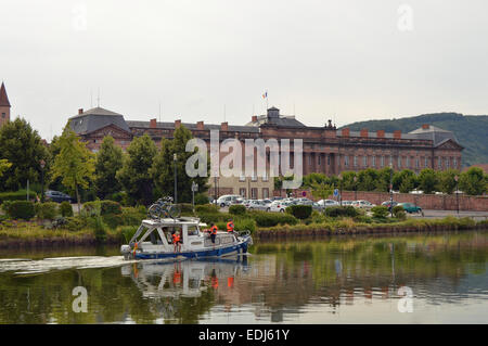 SAVERNE, FRANCE - AUGUST 2012:  A cabin cruiser in front of Chateau des Rohan in Saverne, the Bas-Rhin department in France Stock Photo