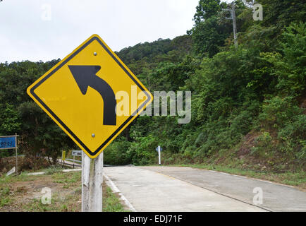 Sign turn left in the jungle, rainforest Koh Lanta, Mu Ko Lanta National Park, Thailand, Southeast Asia. Stock Photo