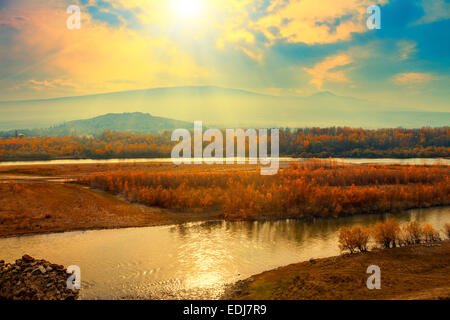 Foggy sunset over mountain river