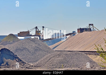 Heavy excavator loader at soil moving works at quarry Stock Photo
