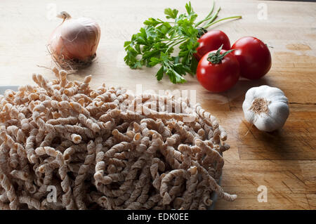 corkscrew shaped raw pasta called busiate with whole wheat flour  of buckwheat typical of Sicily Stock Photo