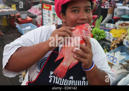 Vendor with Fresh Red Snapper at night market Krabi, Thailand, Southeast Asia. Stock Photo