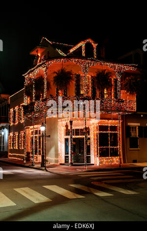 Christmas decorations hang from a shop in the French Qtr of New Orleans at night Stock Photo