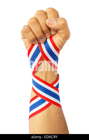 thai man fist and bind thai flag pattern ribbon on forearm on white background(isolated)