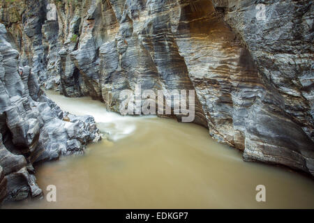 Mountain river running through the rocky canyon. Long exposure shot Stock Photo